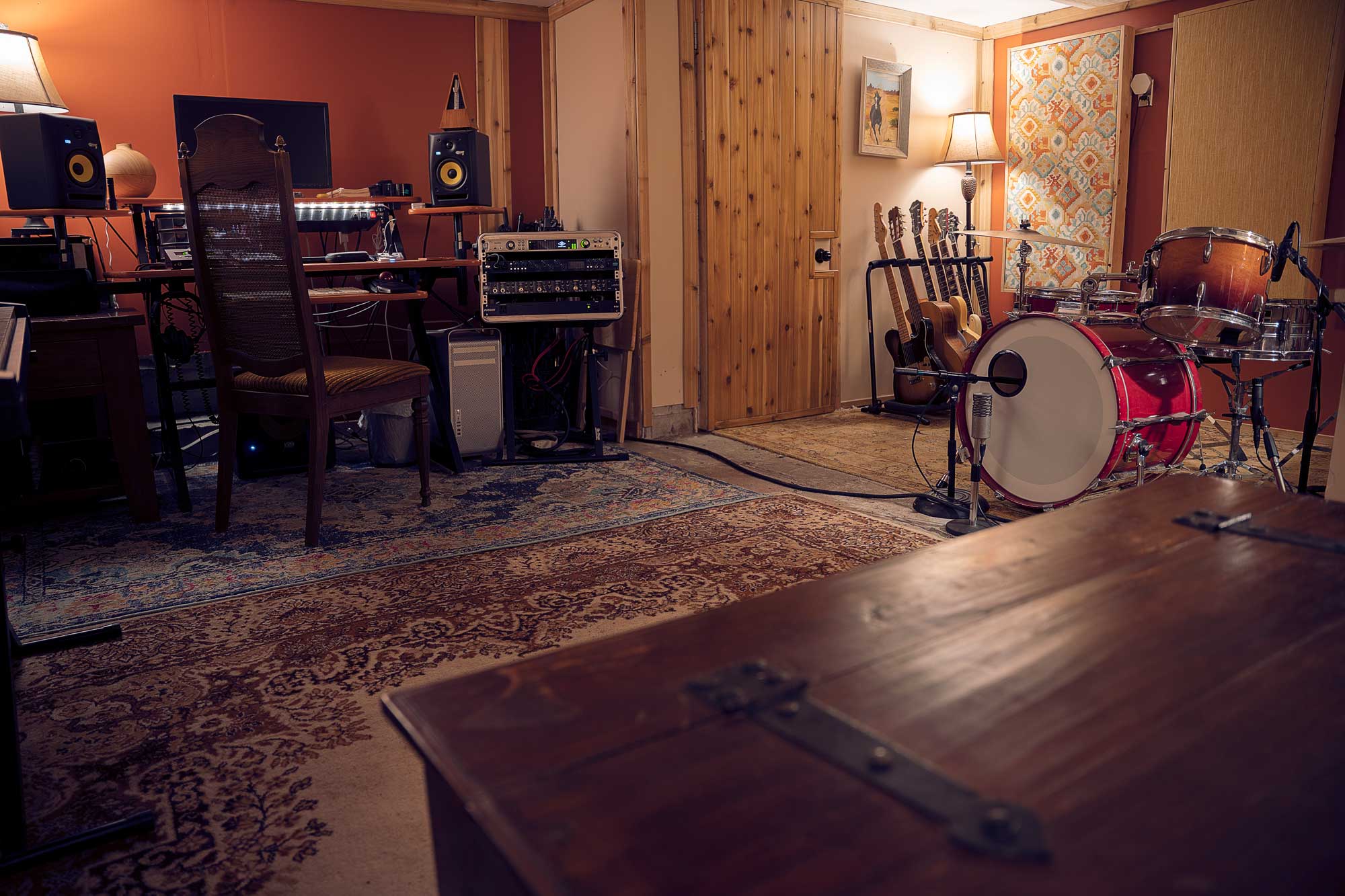 view of the recording studio room from the couch with coffee table